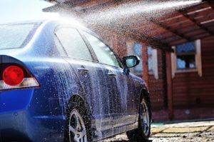 How Often Should I Wash My Car? | Columbia Auto Care & Car Wash in Columbia, MD. Image of blue car washing in open air.